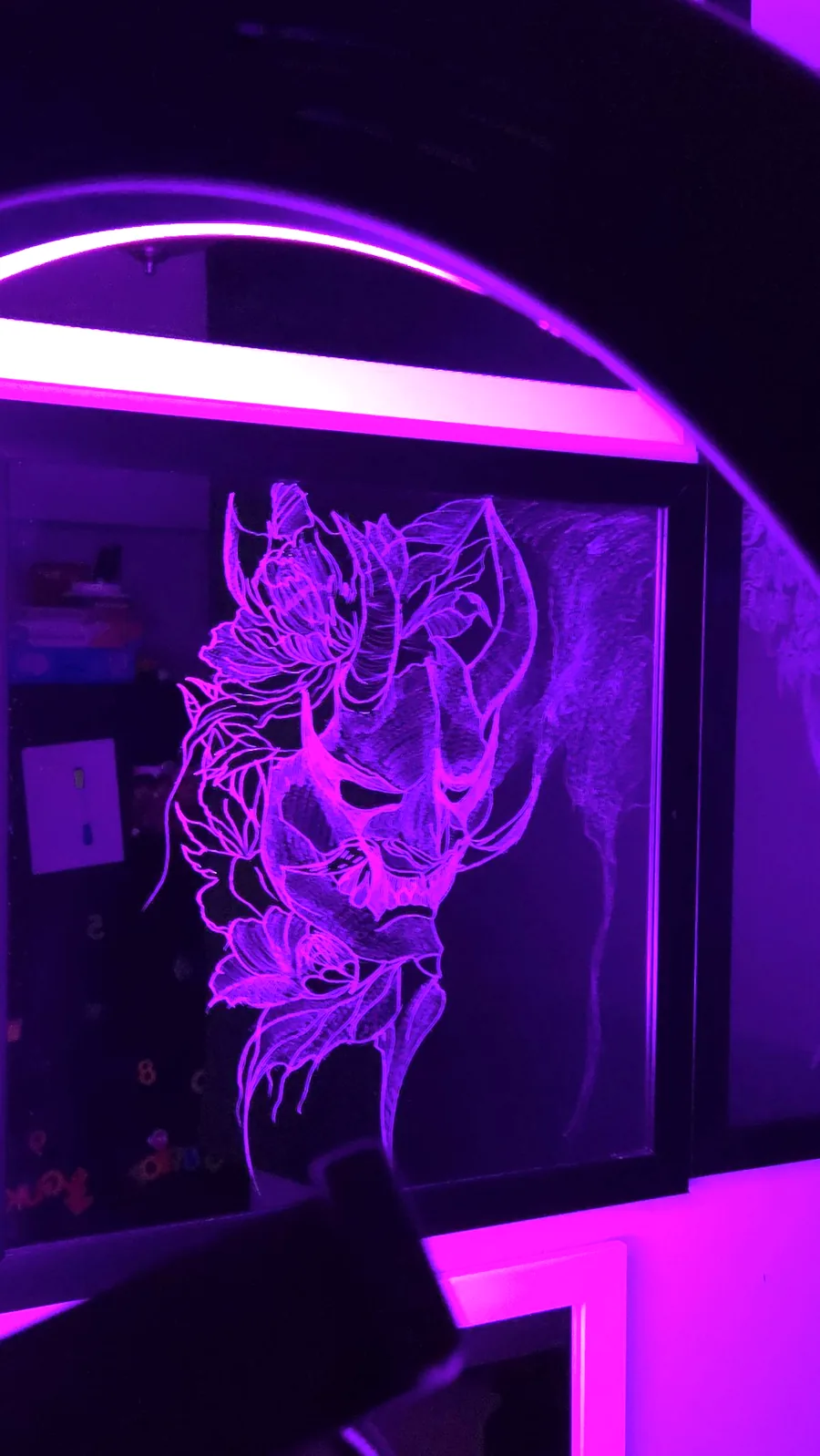 Horned oni mask wrapped in chrysanthemums, hand-etched and lit purple