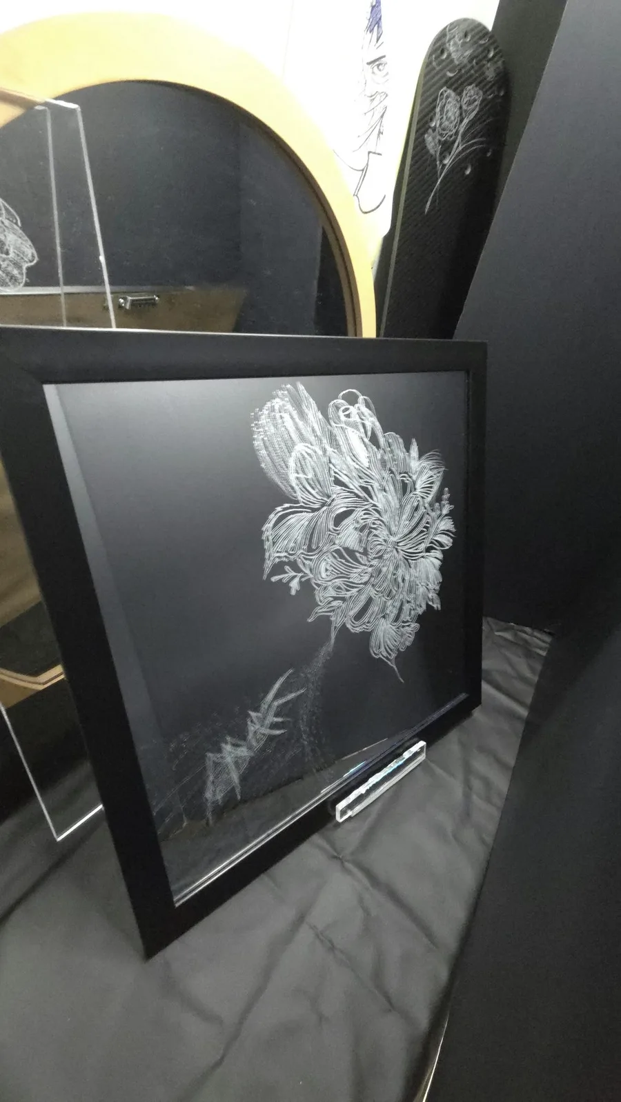 Large etched flower with a spider hidden at its center